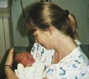 Mom holding me after my bath